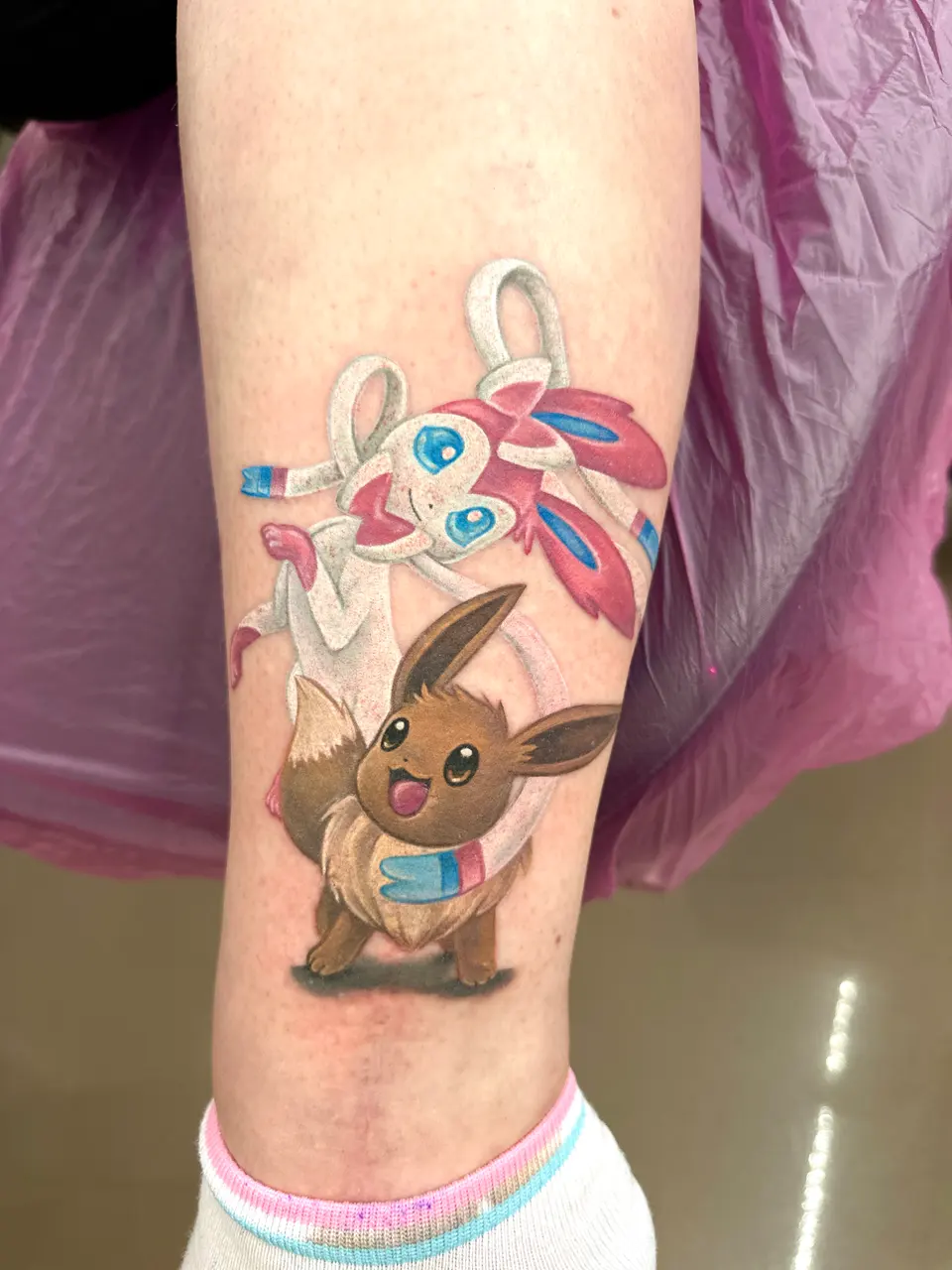 Pokémon Evoli und Feelinara als Tattoo